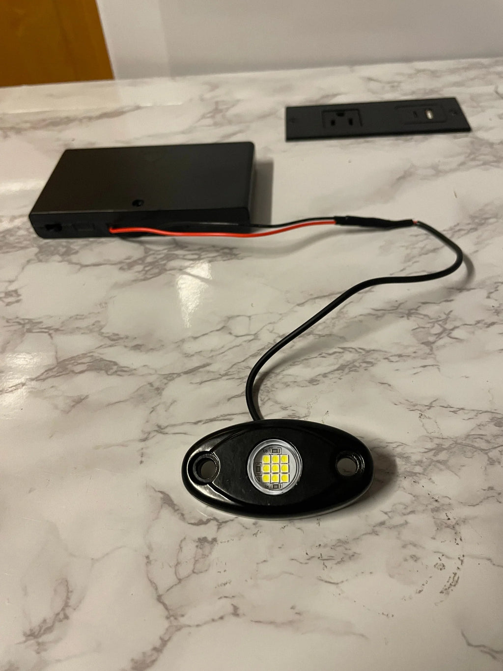 Battery powered rock light